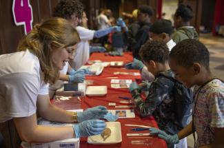 3rd graders holding brains